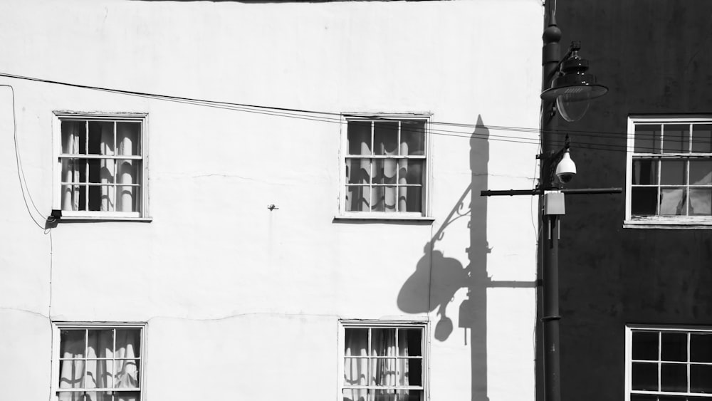 a black and white photo of a building with windows