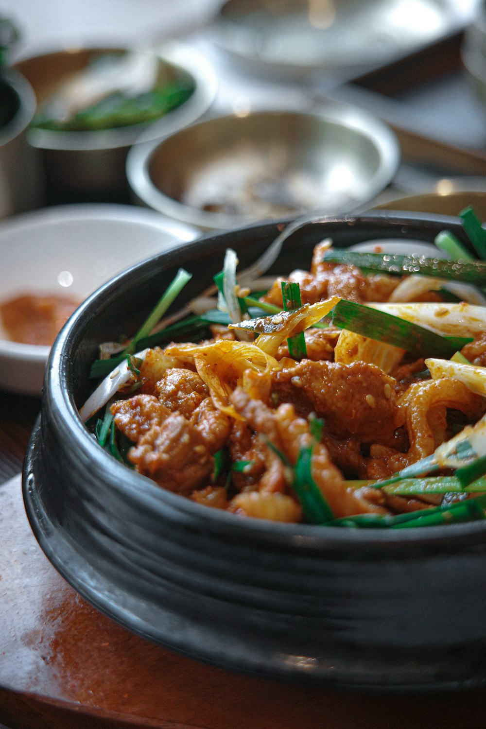 a close up of a bowl of food on a table