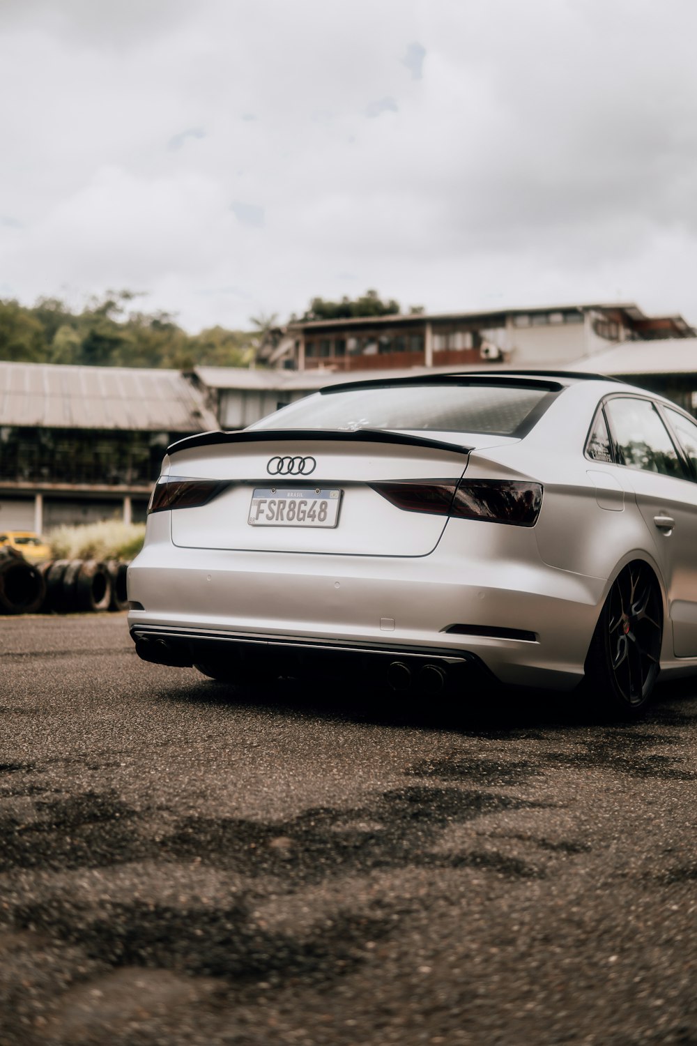 a silver car parked in a parking lot