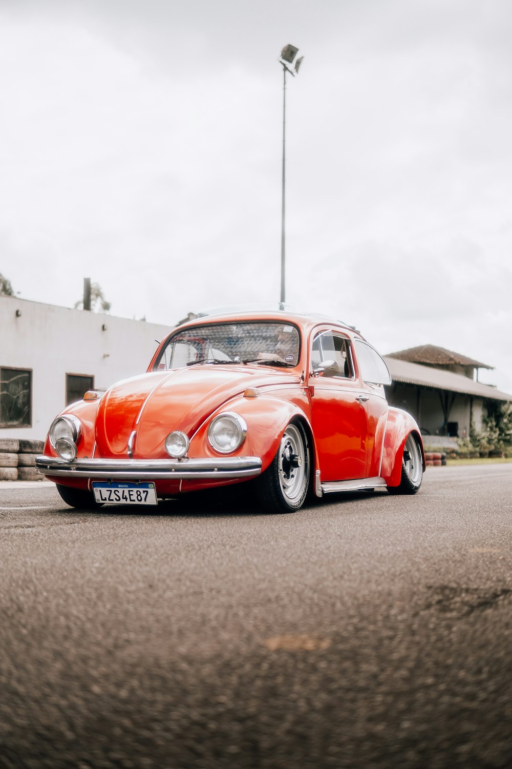 a red car parked on the side of the road