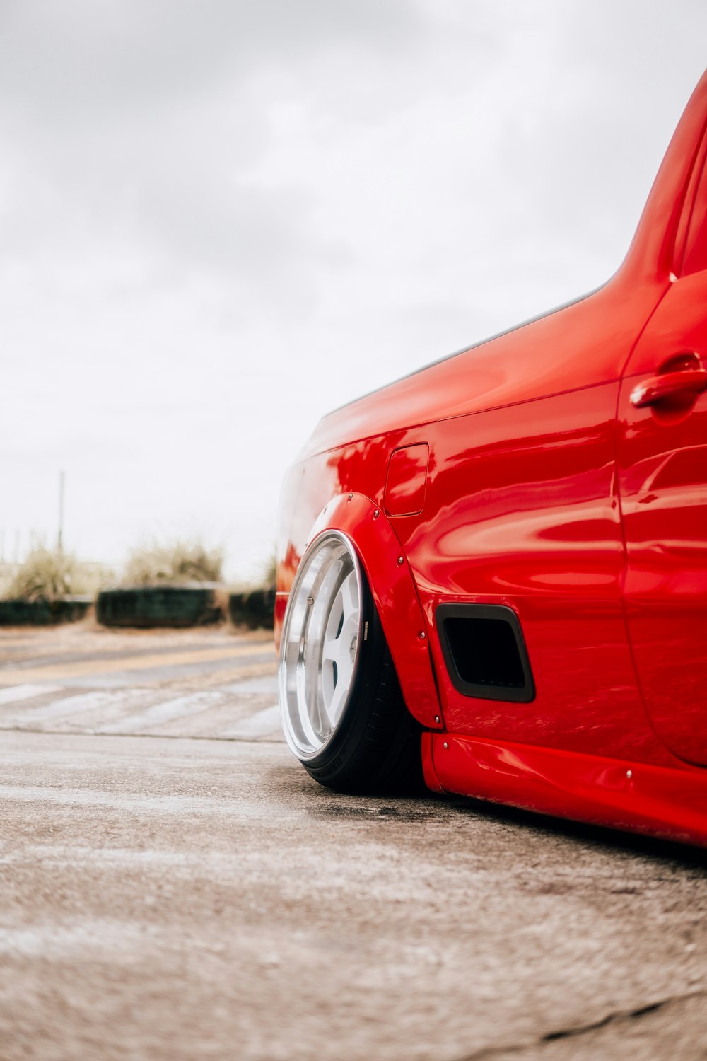 a red car parked in a parking lot