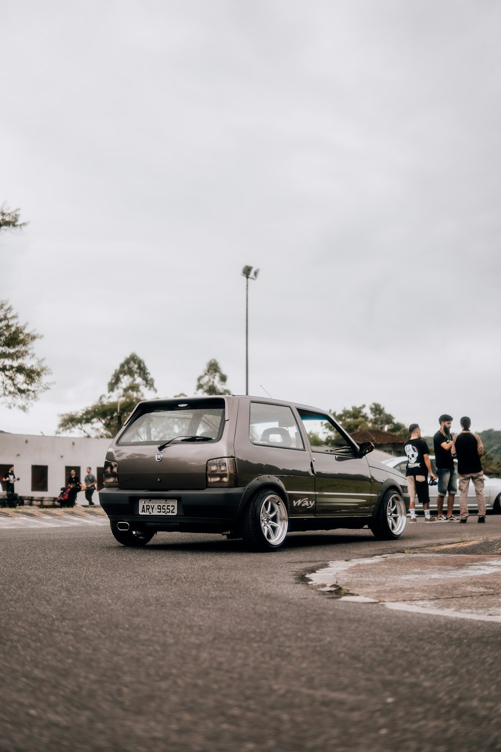 a small car is parked in a parking lot