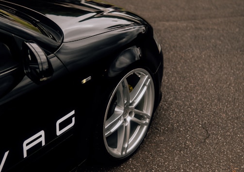 a black sports car parked on the side of the road