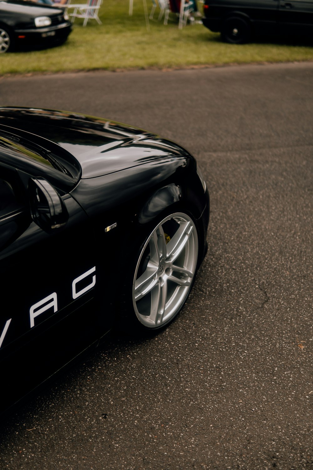 a black sports car parked on the side of the road