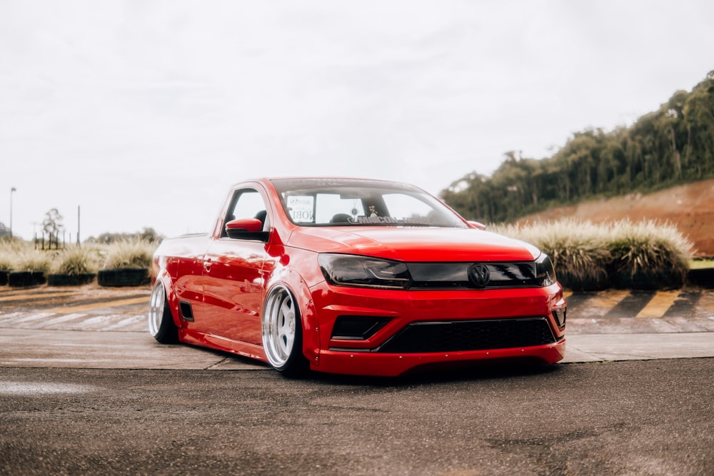 a red car parked in a parking lot