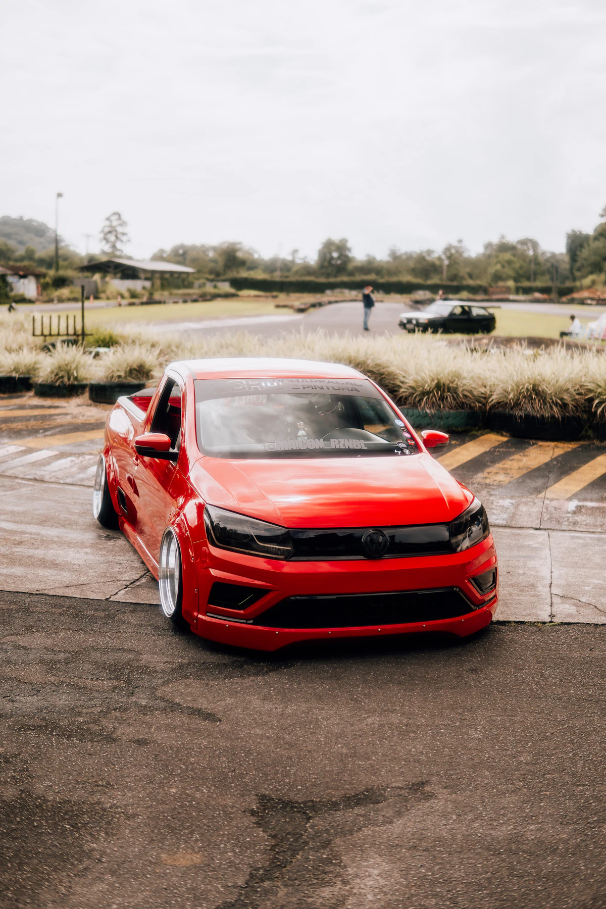 a red car parked in a parking lot