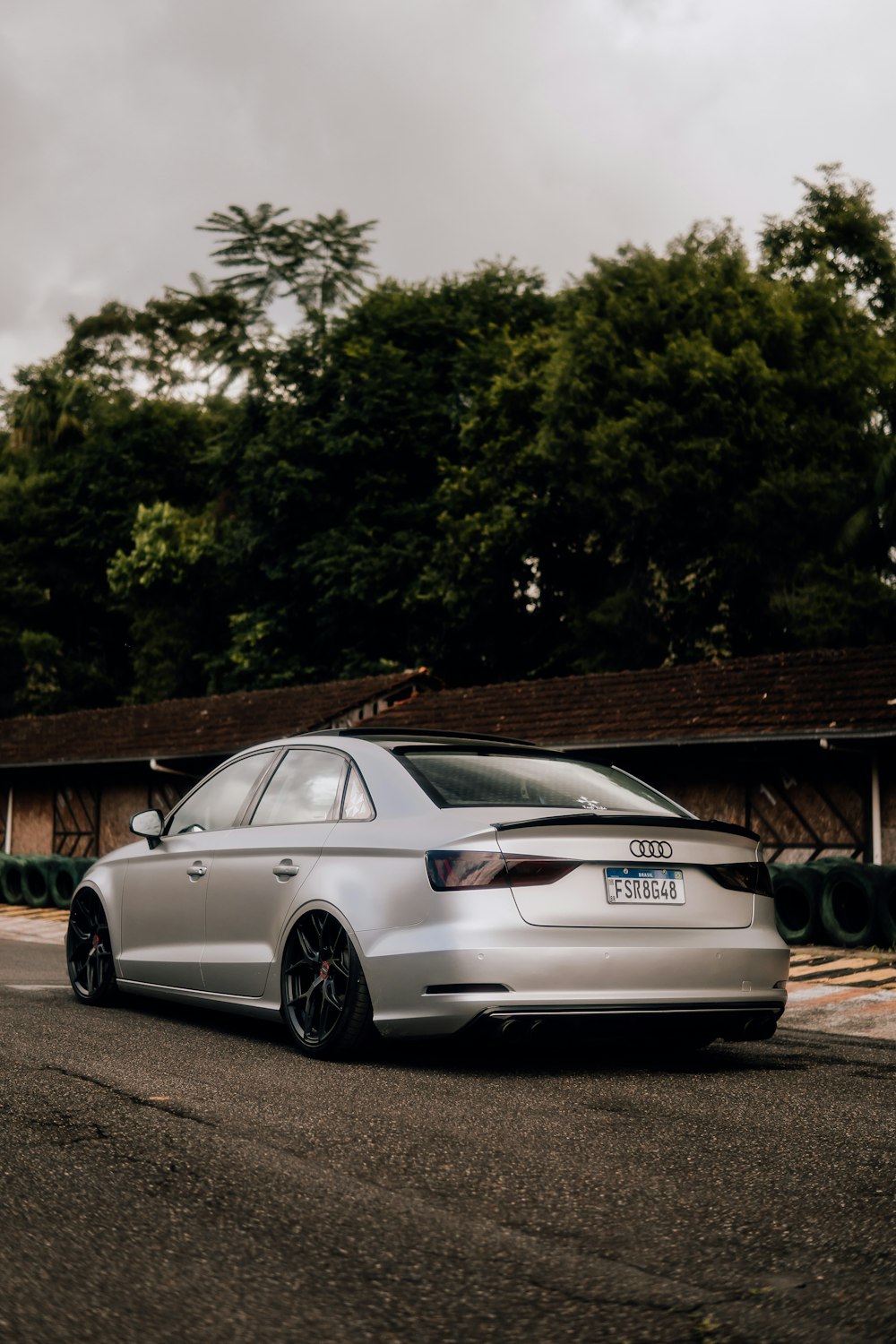 a silver car parked on the side of the road