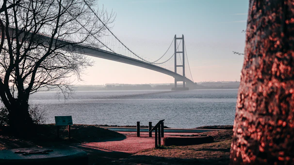 a view of a bridge over a body of water