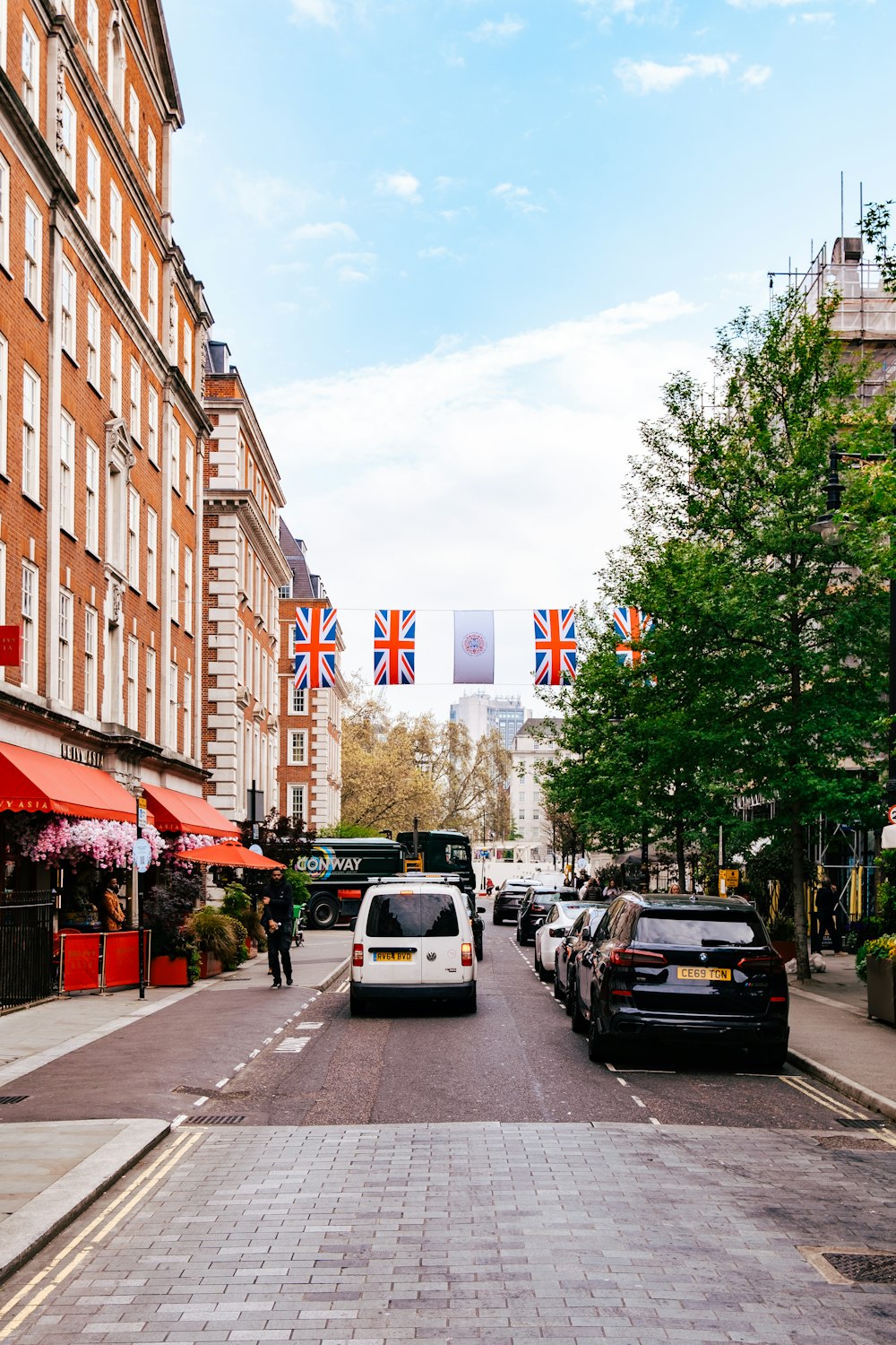 a street with cars parked on both sides of it