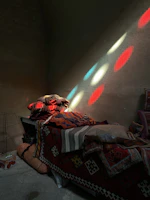 Sunlit bedroom with colorful cushions and modern decor at Rainbow Home.