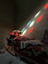 A welcoming workspace with soft, folded blankets and pillows bathed in natural light.