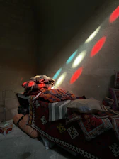 A cozy, softly lit room with cushions and blankets arranged for a group cuddle session.