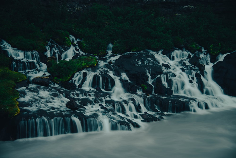 a large waterfall with lots of water coming out of it