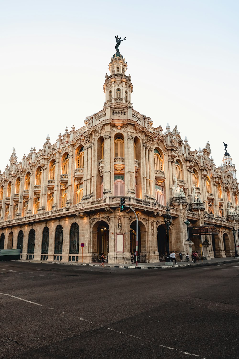 a large building with a statue on top of it