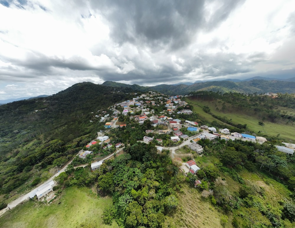 an aerial view of a village in the mountains