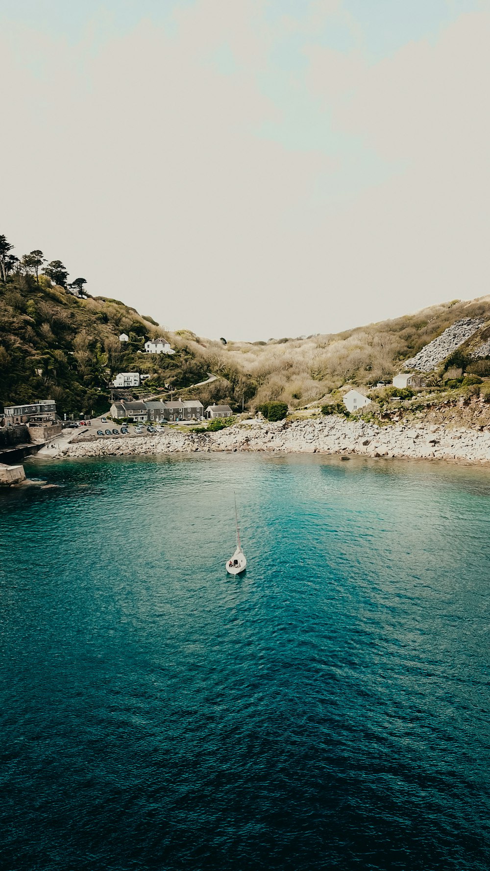 a small boat in a large body of water