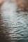 a blurry photo of water with ripples on it