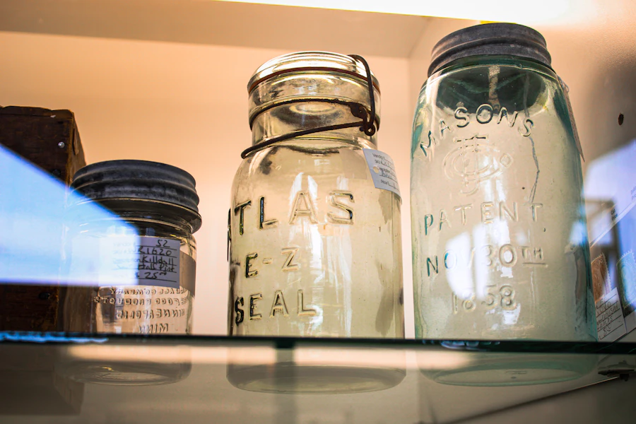 Glass food storage jars arranged on a pantry shelf