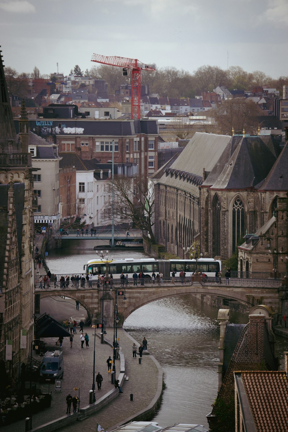 a city street with a bridge over a river