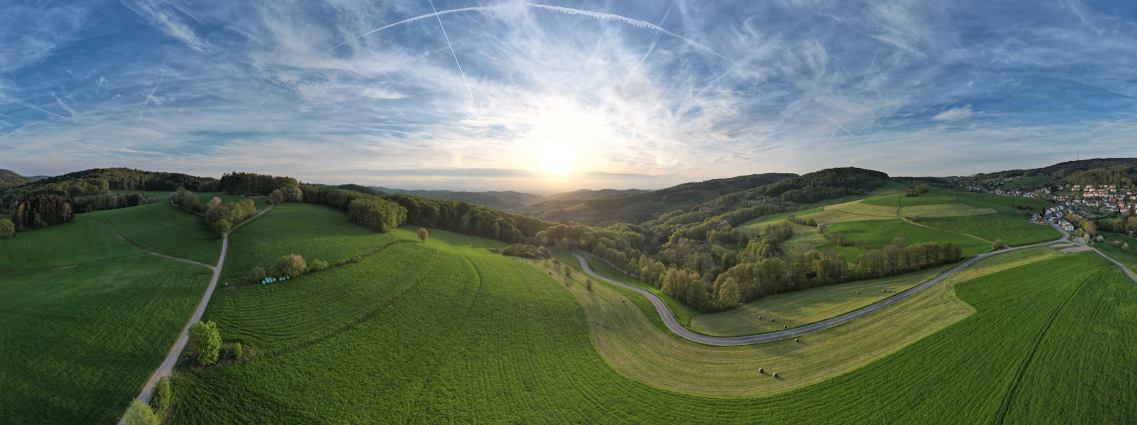 Aerial view of patchwork English fields and hedgerows — the West Country from above.