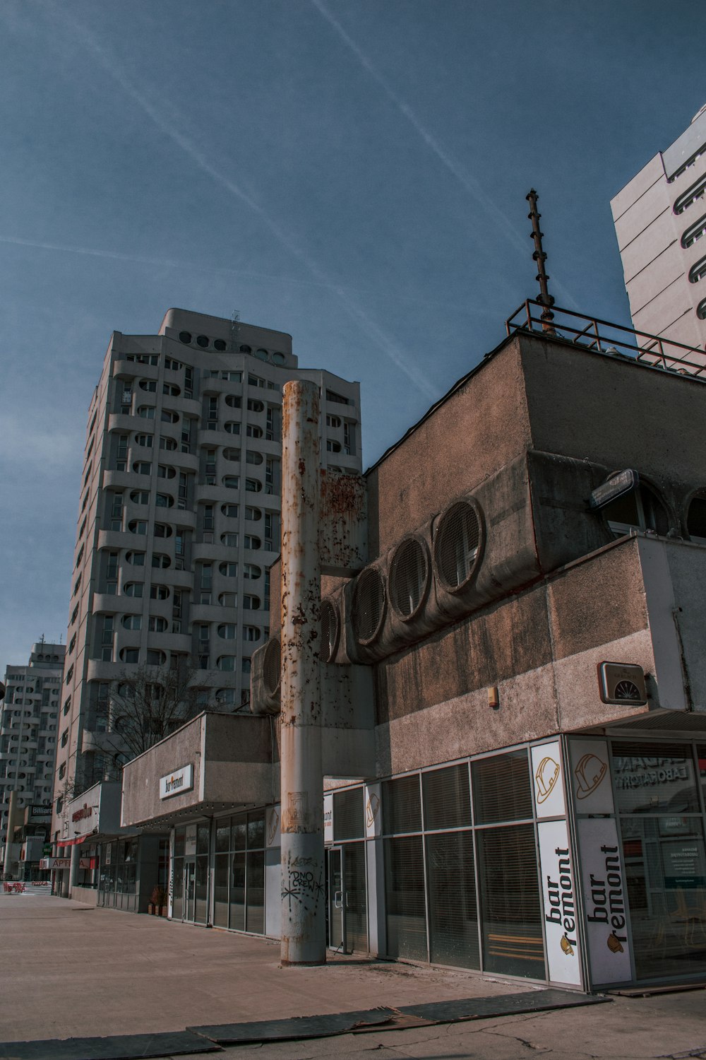 a tall building sitting on the side of a road