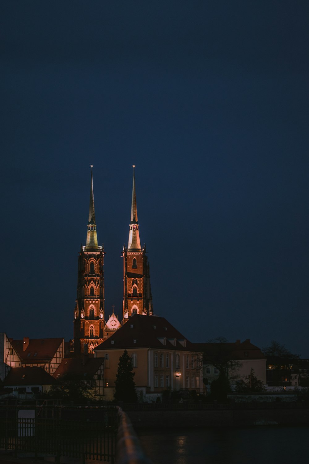 a large cathedral lit up in the night sky