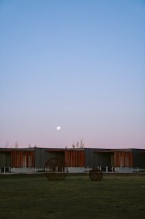 A serene view of the museum's outdoor sculpture garden at sunset.