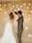 a bride and groom dancing in front of hanging lights