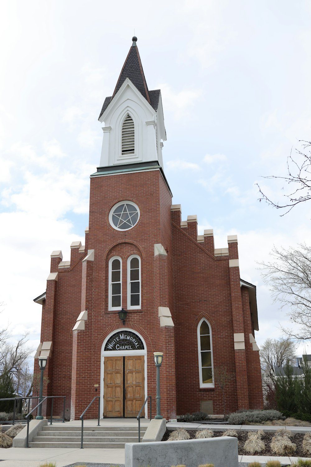 a church with a steeple and a clock tower