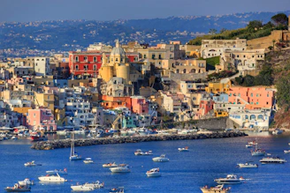 a group of boats floating on top of a body of water