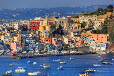 a group of boats floating on top of a body of water