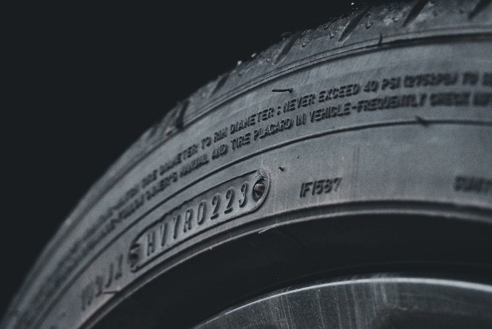 a close up of a tire on a black background