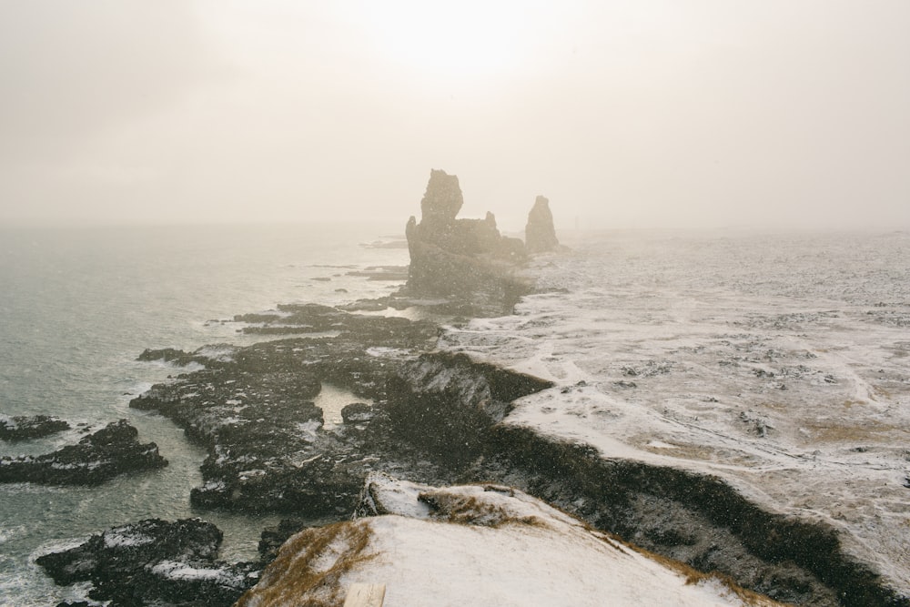 a foggy day on the coast of the ocean