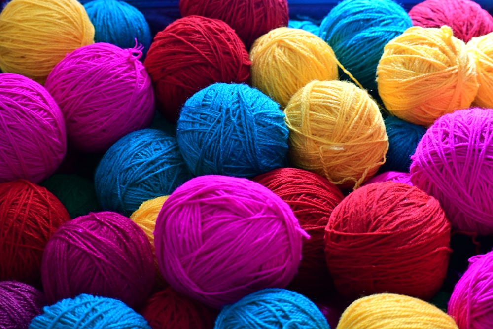 a pile of balls of yarn sitting next to each other