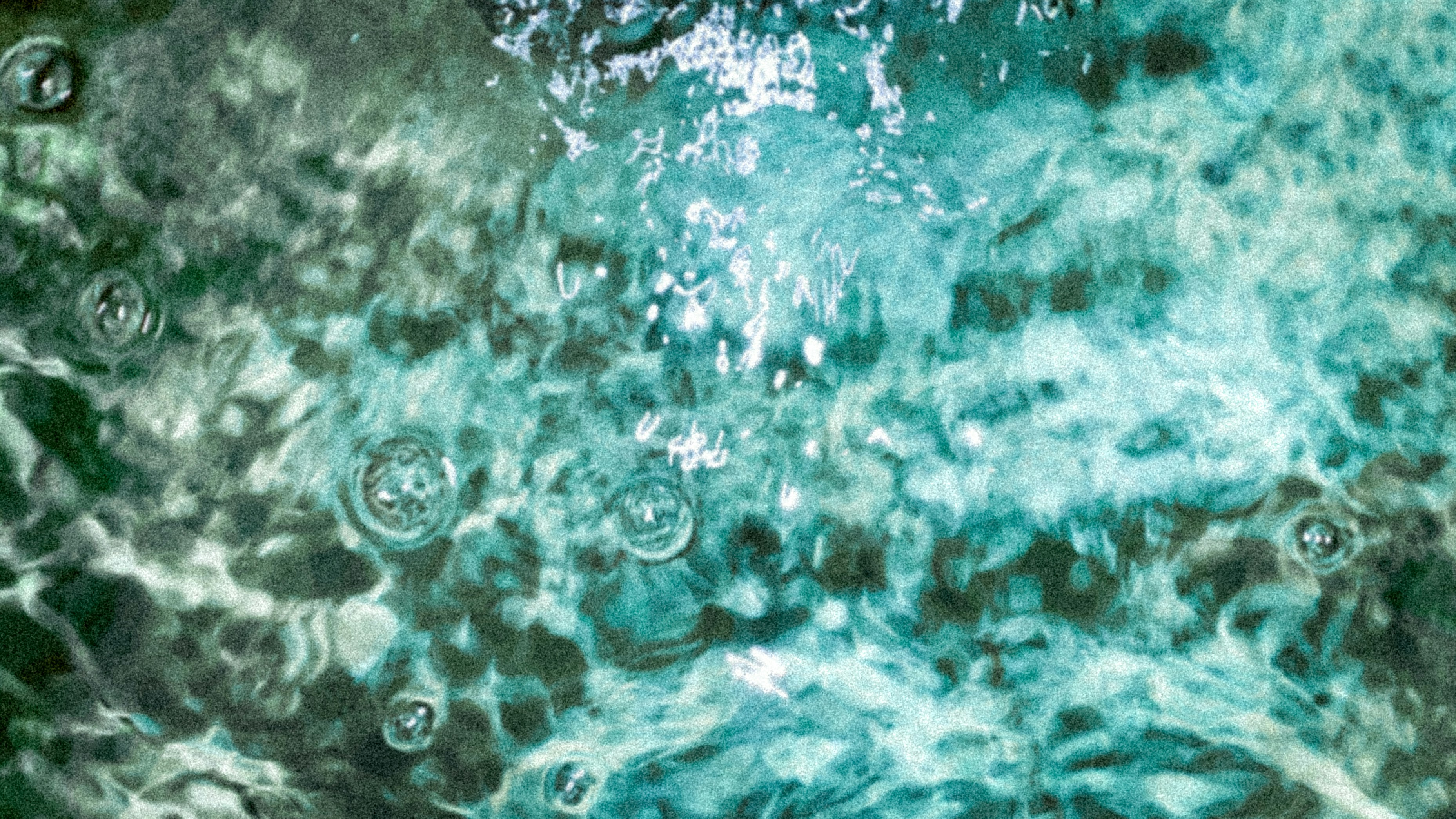a close up of water with bubbles in it