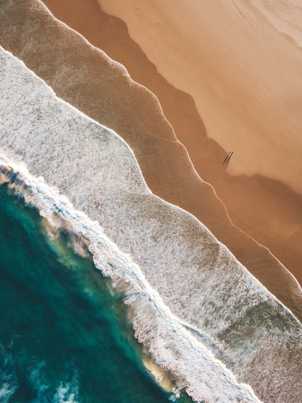 a bird's eye view of a beach and ocean