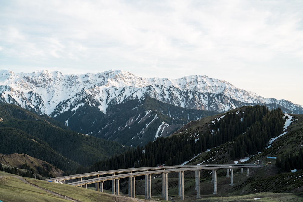 a bridge in the middle of a mountain range