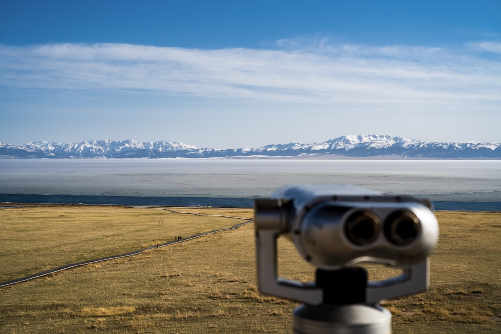a pair of binoculars sitting on top of a field