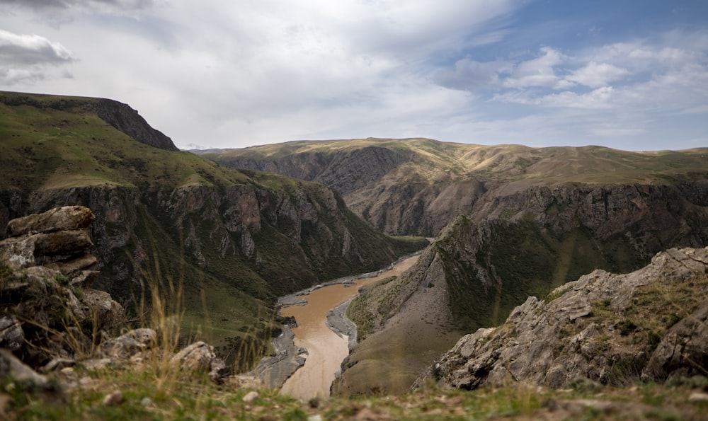 a view of a river running through a valley