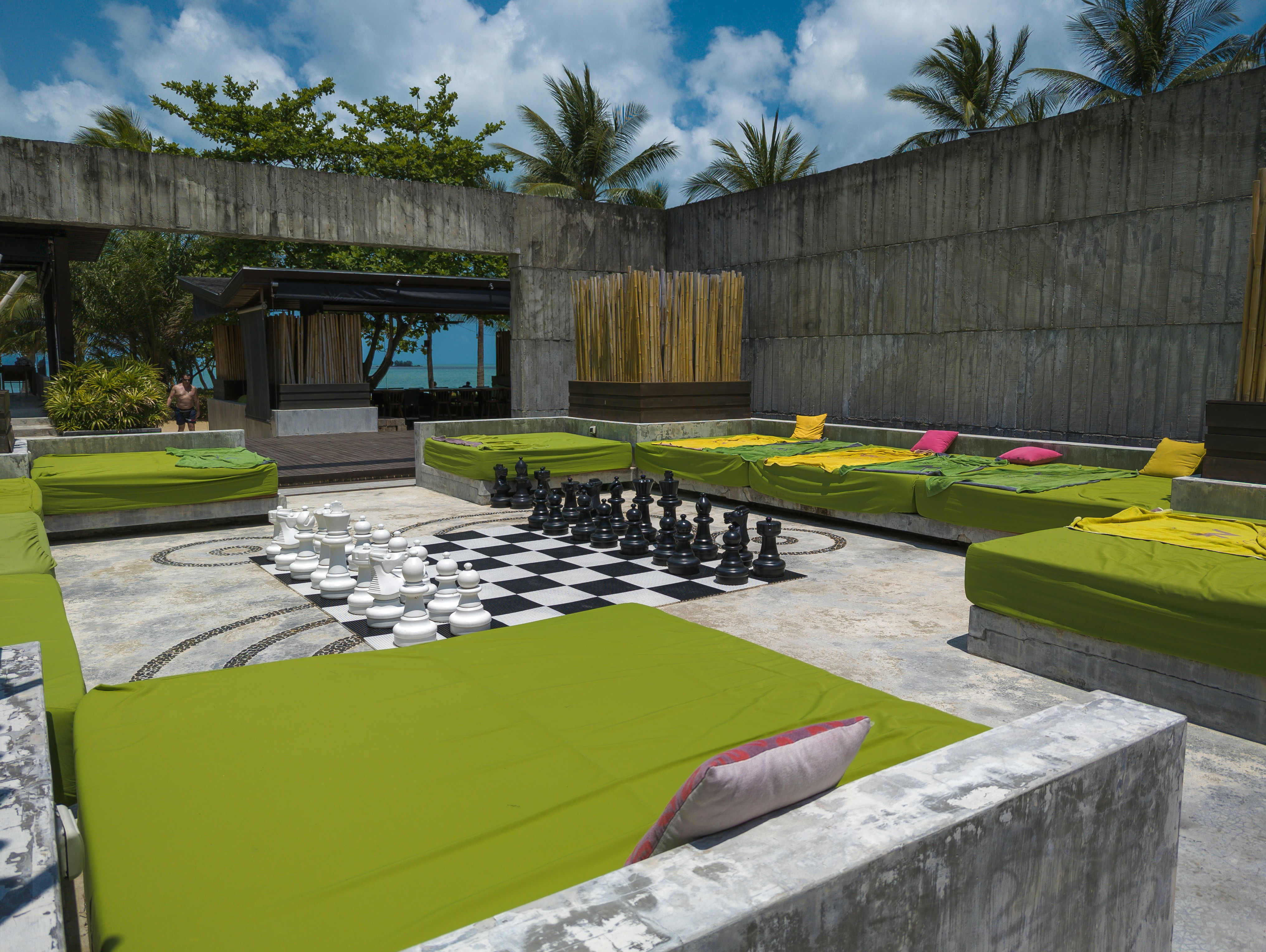 a large chess board set up in a courtyard, 