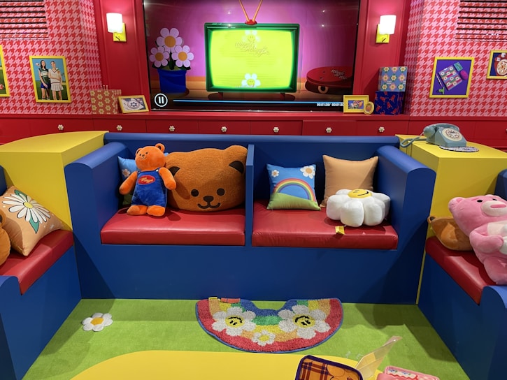 A cozy therapy room with soft pastel colors and child-friendly toys arranged neatly.