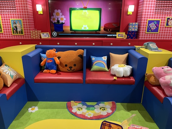 A cozy therapy room with toys and comfortable seating for children.