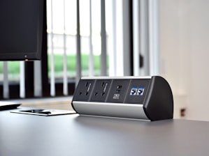 an electronic device sitting on top of a desk