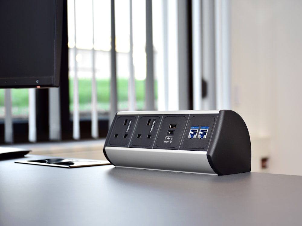 an electronic device sitting on top of a desk