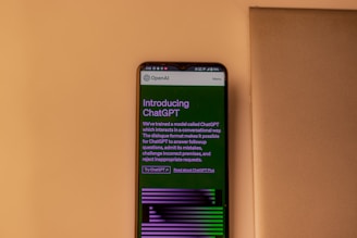 a cell phone sitting on top of a wall