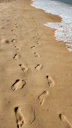 a sandy beach with footprints in the sand