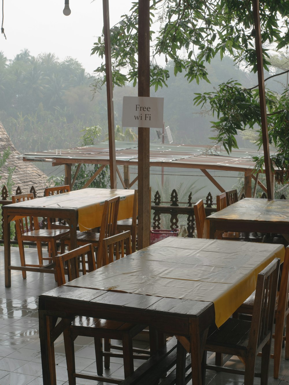 a table and chairs with a sign on it