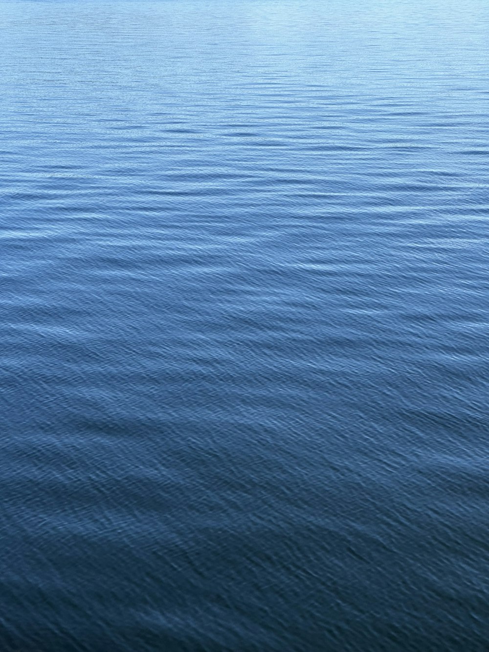 a boat floating on top of a large body of water