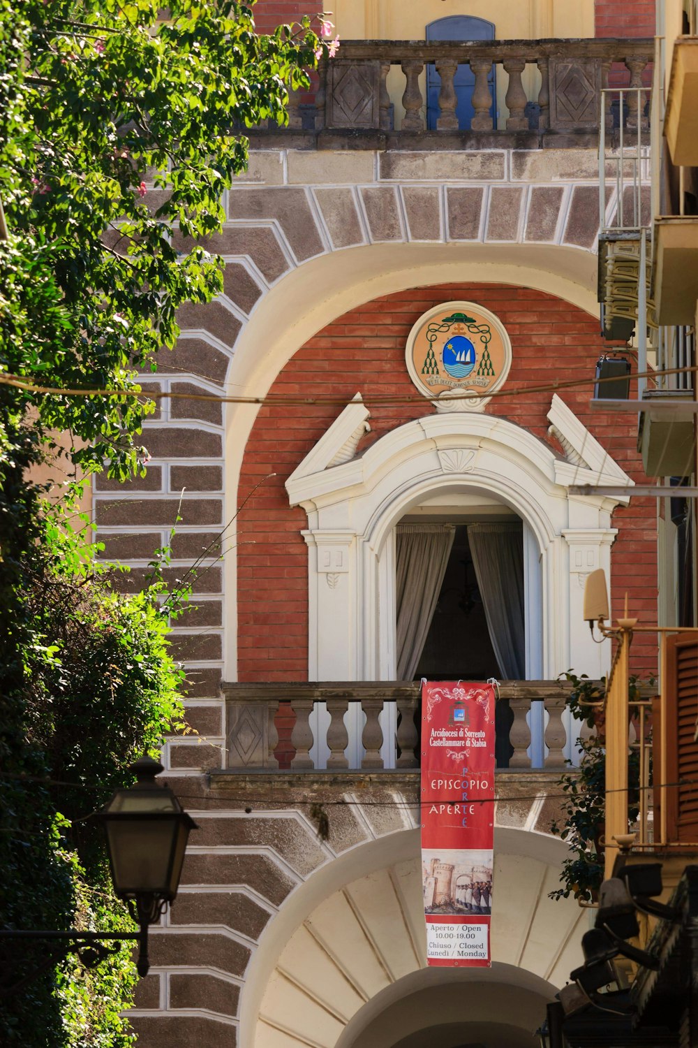 a brick building with a clock on the front of it