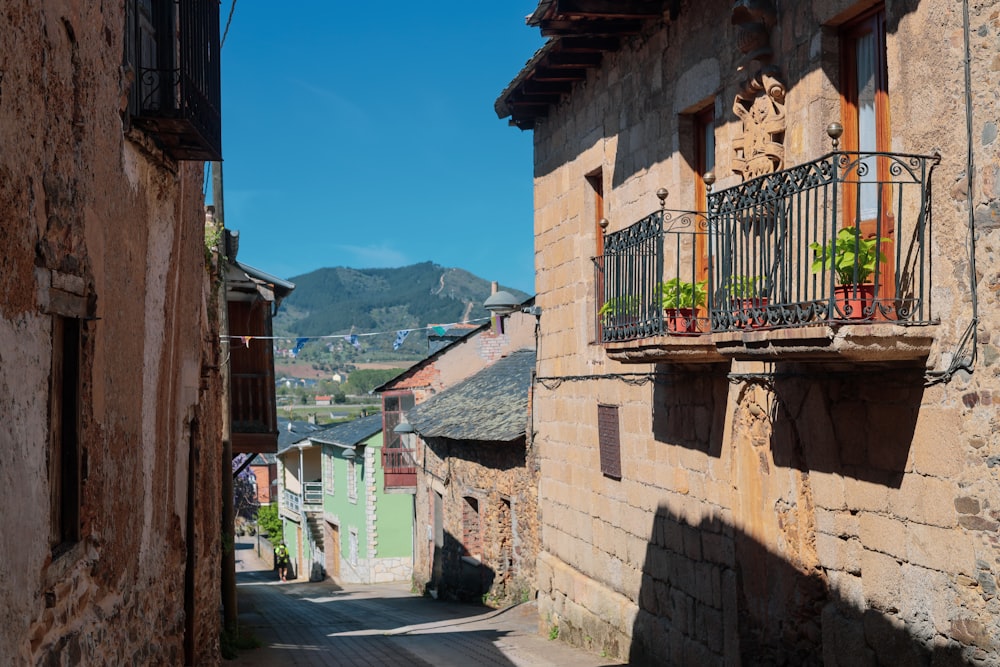 a narrow street with a balcony and balconies